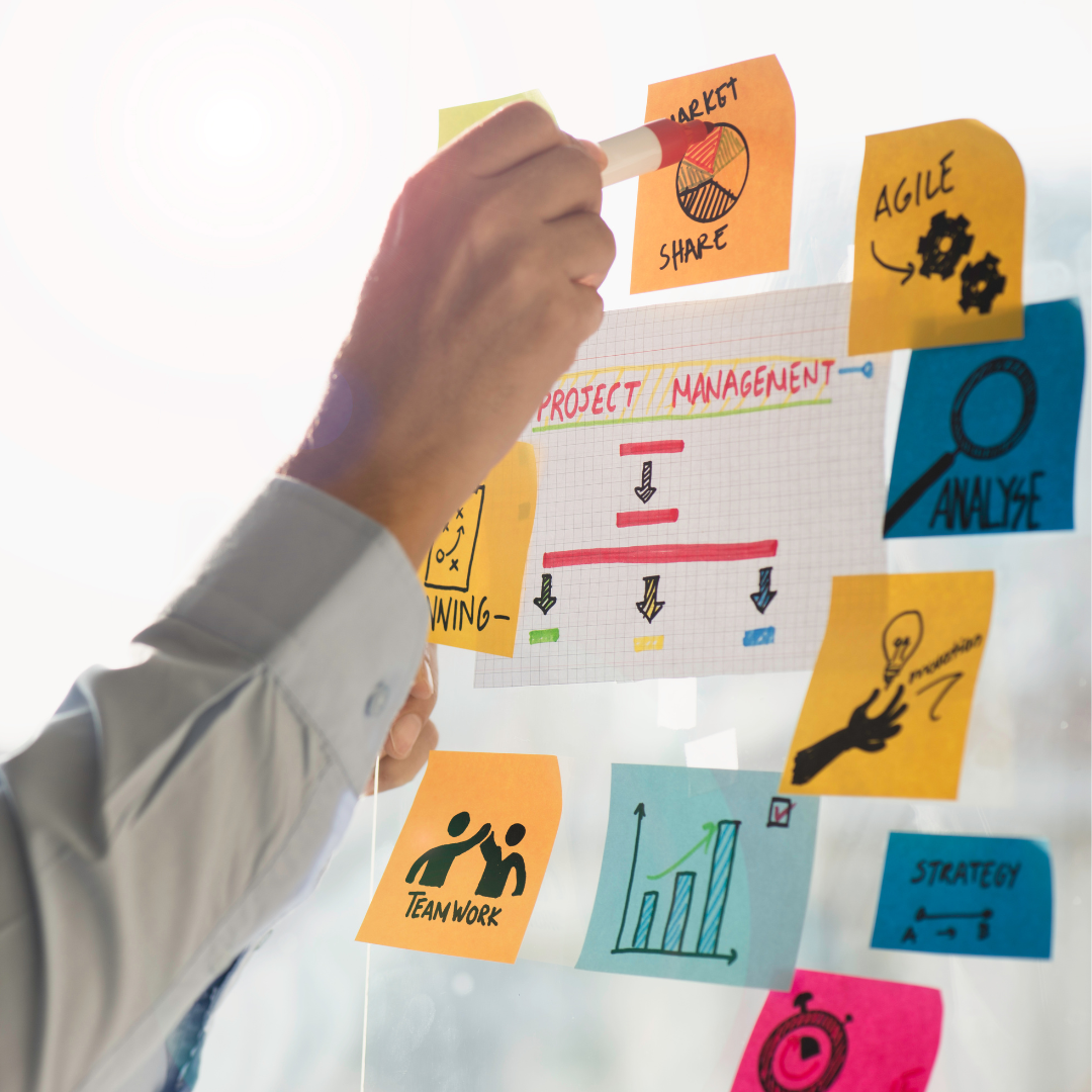 Online Business Manager working at laptop managing team projects and business operations